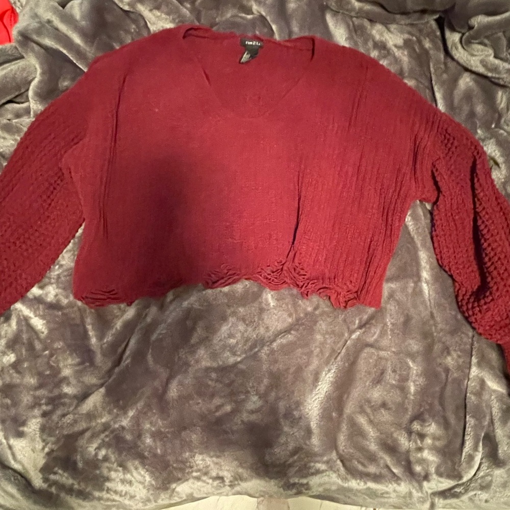 This is a Maroon sweater from Rue 21 that is used.